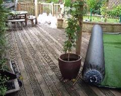 The artificial grass ready to overlay the decking in Yeovil